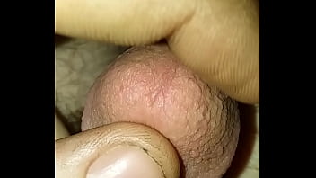 rubbing tip of dick