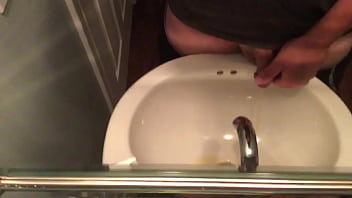 peeing into the sink