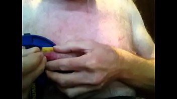 nails hammered into nipples