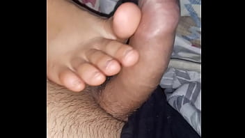 footjob while watching movie