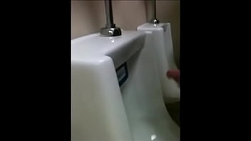 wanking at the urinal