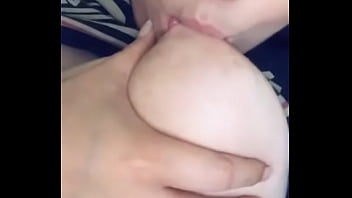 biting her own nipples