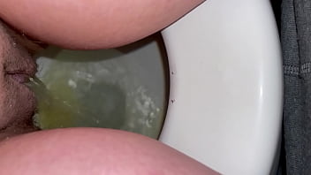 schoolgirl peeing in toilet
