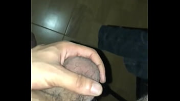 man rubbing his cock